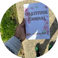 a person holding a gratitude journal
